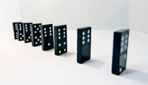 black dominoes standing in a row