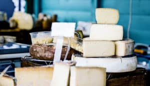 cheese shop with wheels stacked