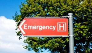 hospital emergency sign on road