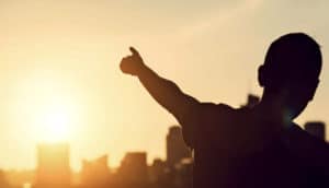 man pointing at the sky