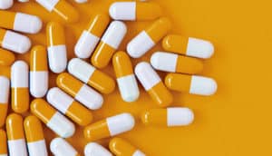 pills on an orange background