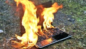 laptop computer on fire (quantum computer concept)