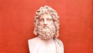 Roman bust of bearded man against red well in Uffizi Gallery