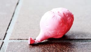 deflated balloon on tile