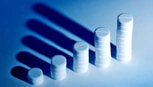 pills arranged in increasing bar graph (opioids concept)