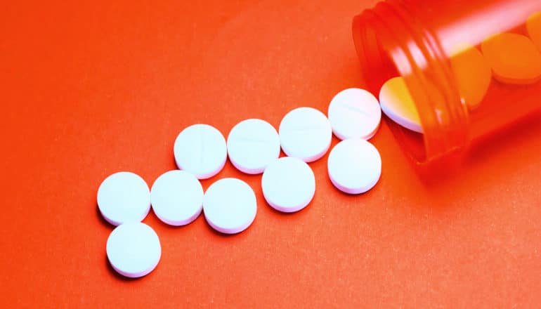 pills spill on orange (fluoroquinolones concept)