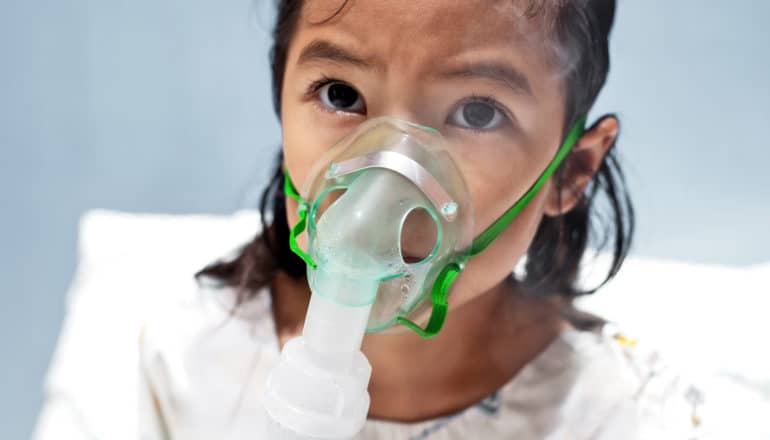 girl with oxygen in hospital