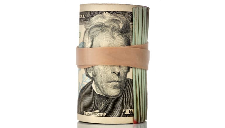 rubberband over Jefferson's eyes in cash roll (intergenerational mobility concept)