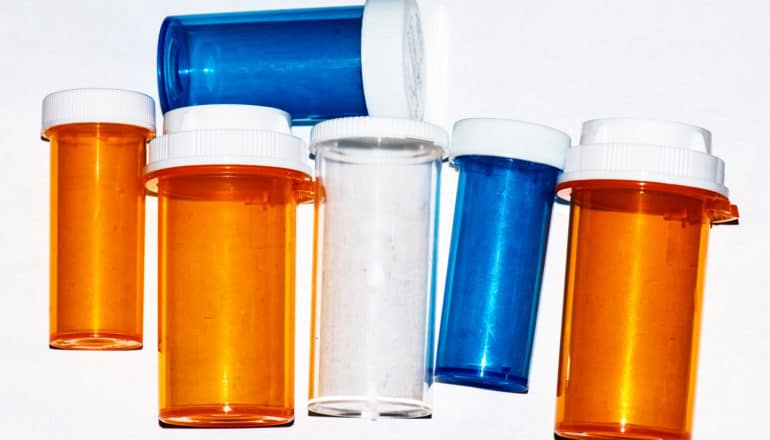 pill bottles on white - generic drugs