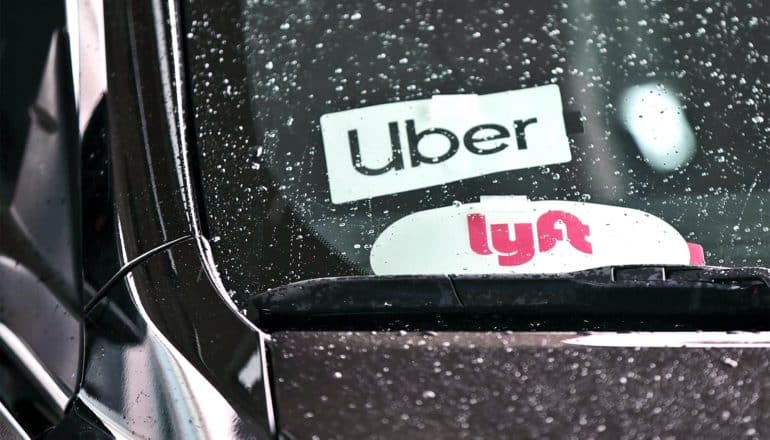 uber and lyft stickers on car (ride-hailing apps concept)