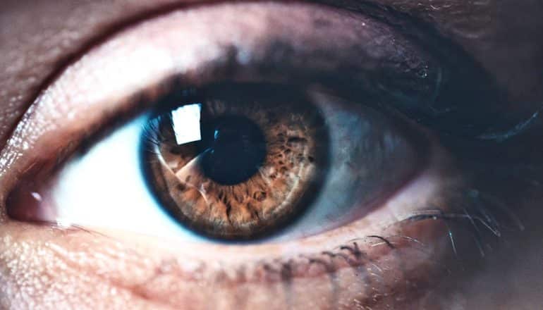 close-up shot of brown eye - reading breast tissue biopsies