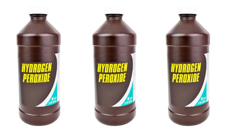 three brown bottles labeled hydrogen peroxide