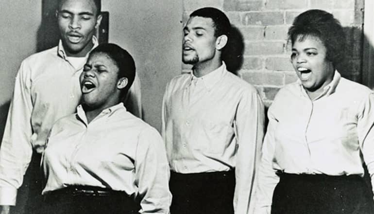 Pictured, left to right, are Charles Neblett, Bernice Johnson, Cordell Reagon and Rutha Harris sing together in 1963. (civil rights movement concept)