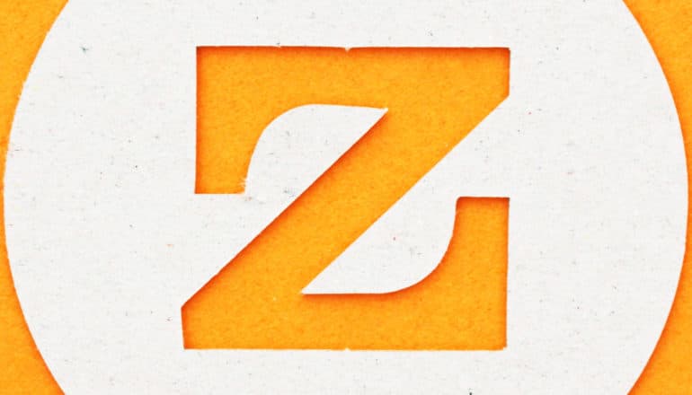 letter z cut-out of cardboard on orange - zinc as key to gonorrhea