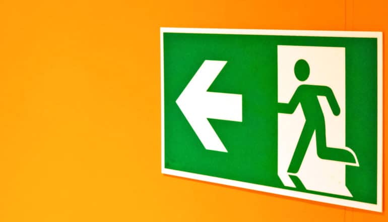 exit sign shows running figure and arrow