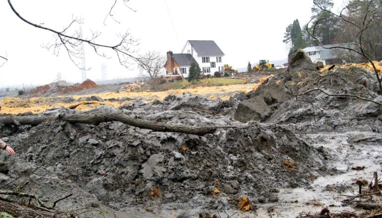 sludge in the foreground, a house in the background