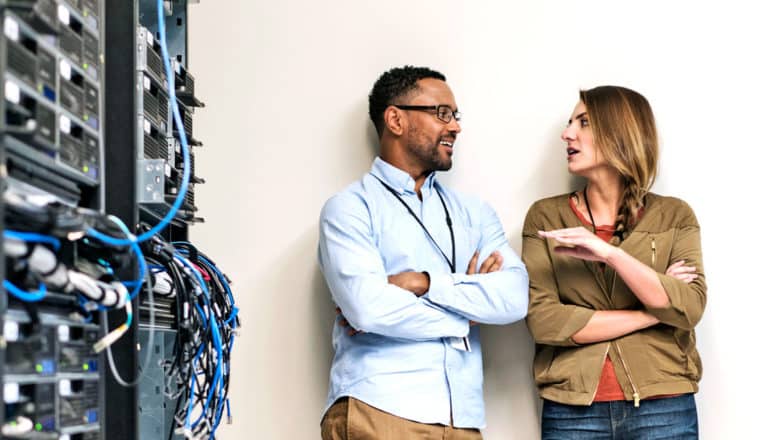 two people chat in server room