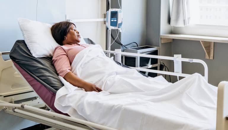 person in hospital bed