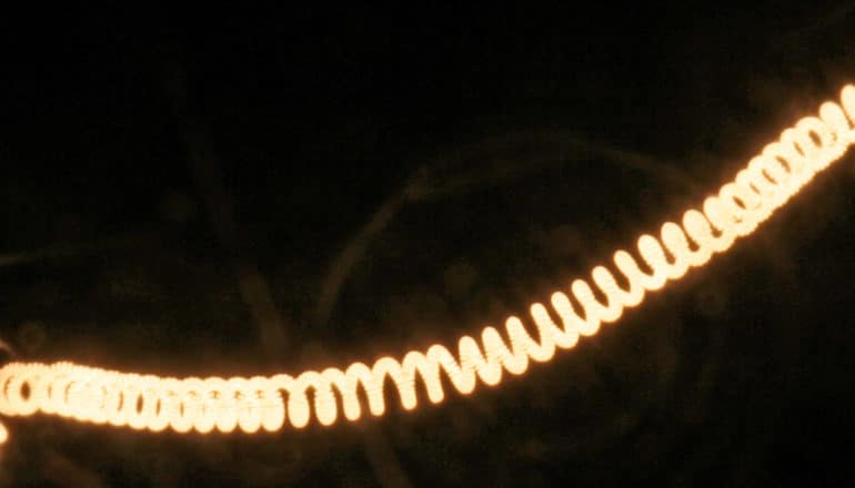 glowing spiral filament in the dark