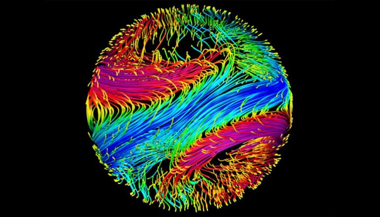 Swirls of green, red, and blue make up a view of the exoplanet