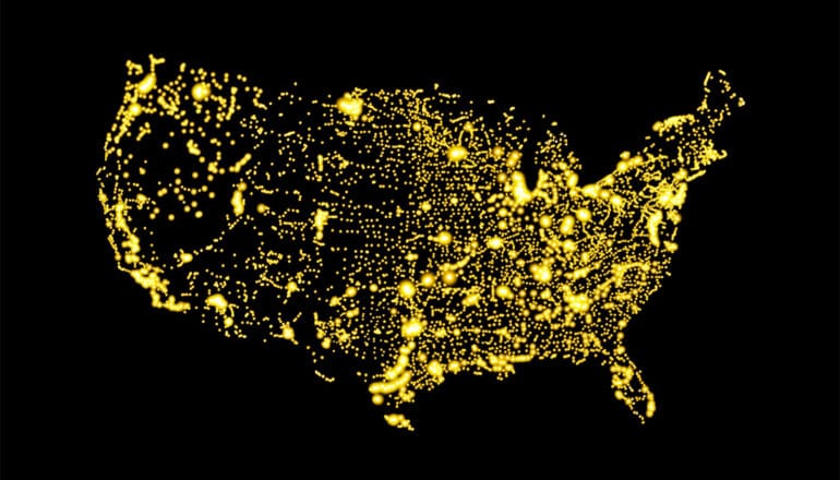 A map of the US in lights against black