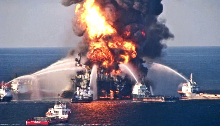 Boats spray water on the Deepwater Horizon oil platform