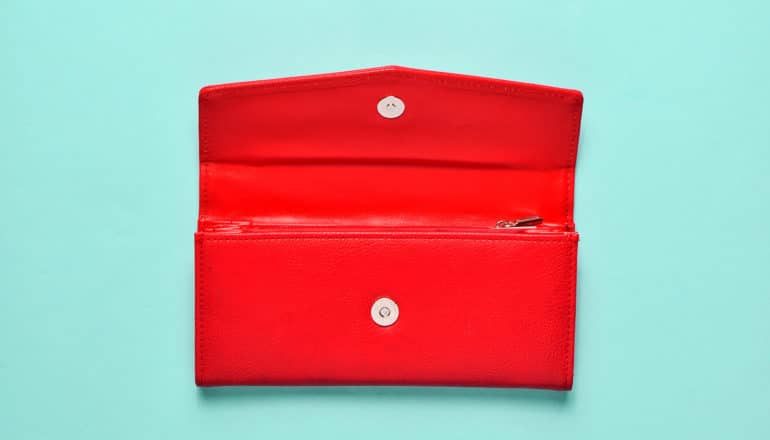 red wallet on mint green background