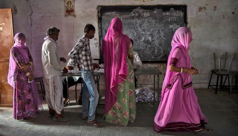 people line up to vote