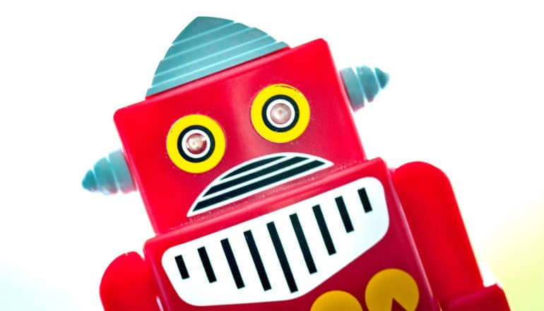A red, boxy robot appears on a white background