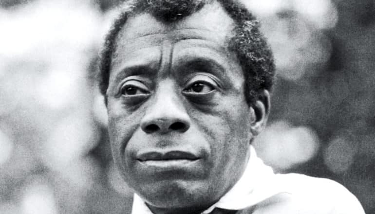 James Baldwin looks off into the distance