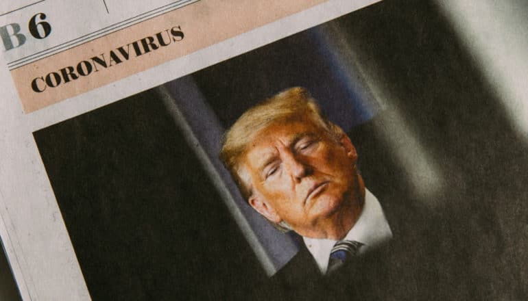 part of newspaper says "B6 coronavirus" above photo of Trump