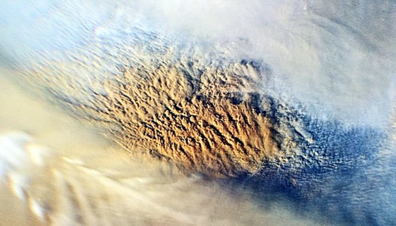 Clouds from a dust storm on Mars looks reddish and white