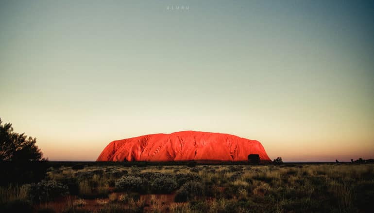 red rock mound in otherwise flat landscape