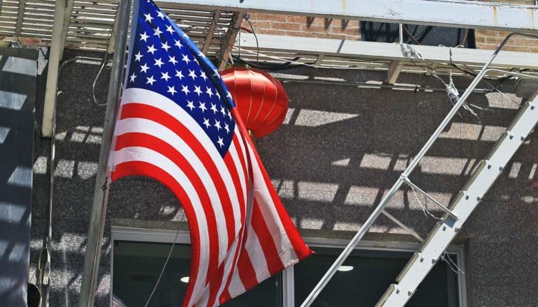 Chinese lantern and US flag on fire escape