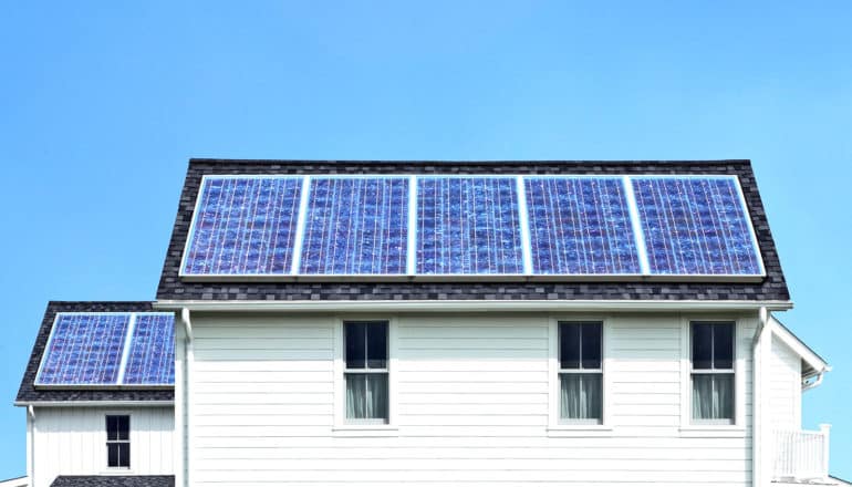 solar panels on roof of white house