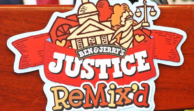 Ben and Jerry's branding shows courthouse, lady justice, and says "Justice ReMix'd"