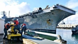 An aircraft carrier sits in