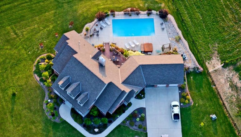 large home with pool from above