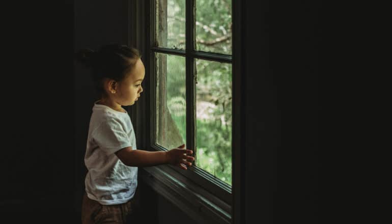 child at window