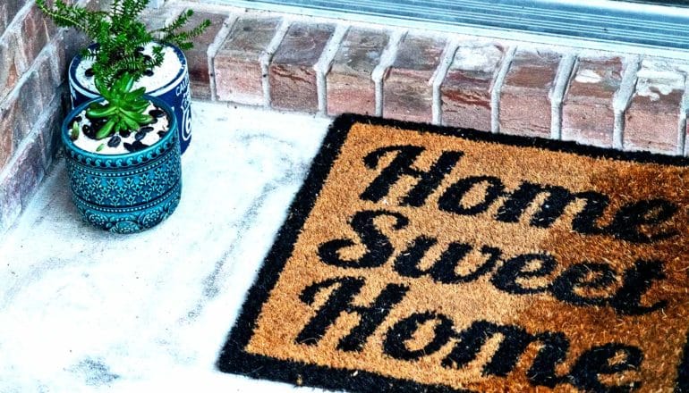 A welcome mat reads "Home Sweet Home"