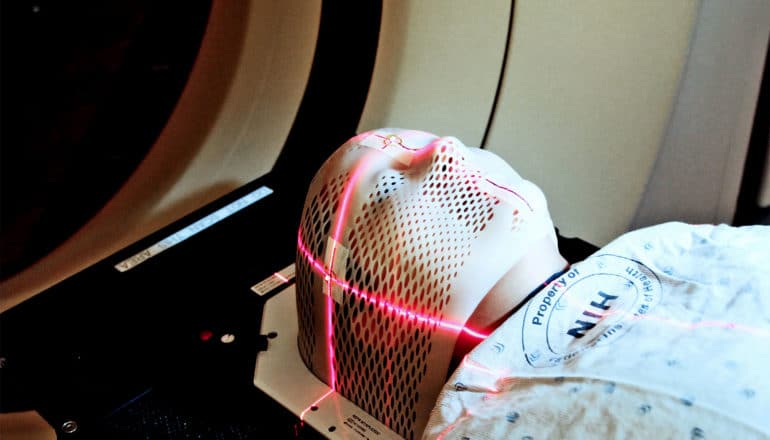 A person undergoes a brain scan for cancer