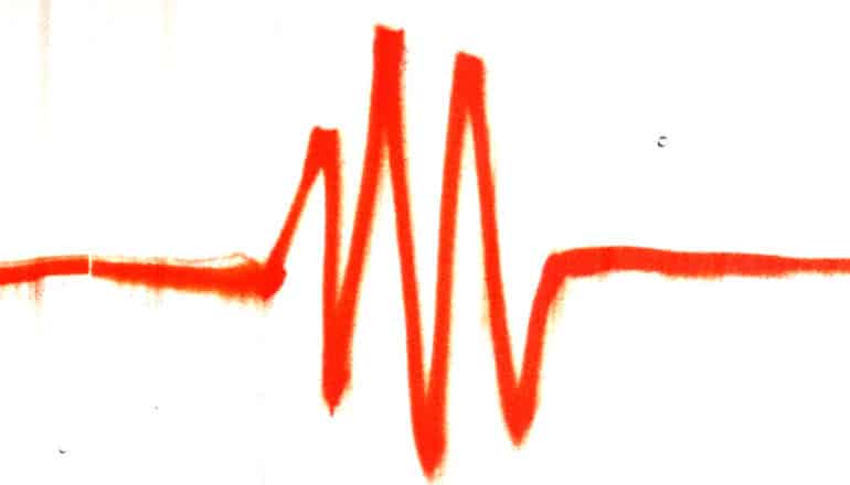 An orange spray-painted line that looks like a heartbeat monitor