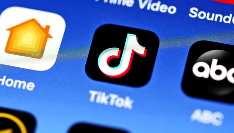 The app icon for TikTok sits on a blue background