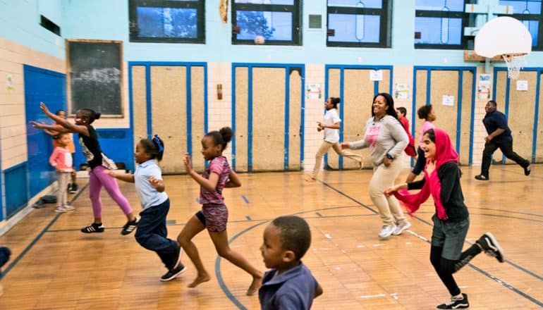 kids run in gymnasium