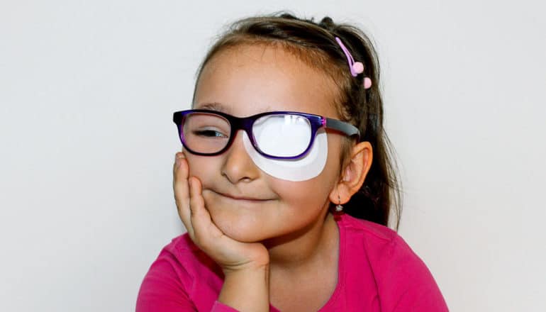 cute kid with eye patch and glasses