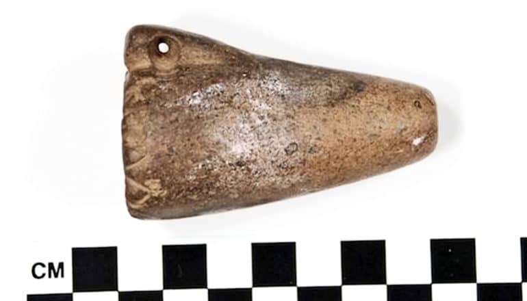 The ancient pipe for smoking plants looks like a small, brown piece of a horn, with a conical shape