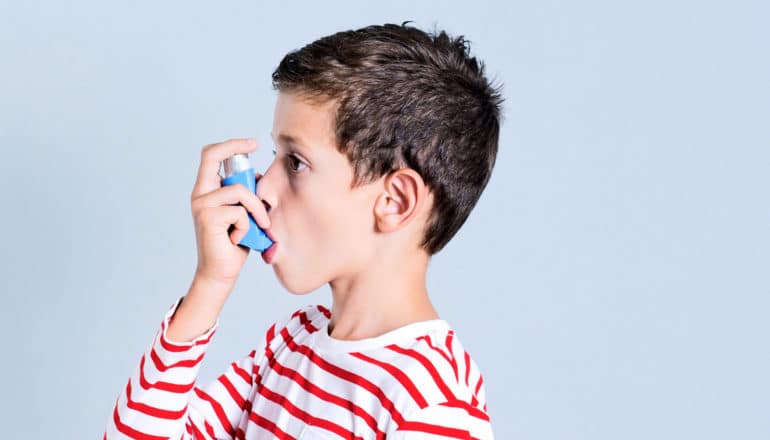 child uses inhaler