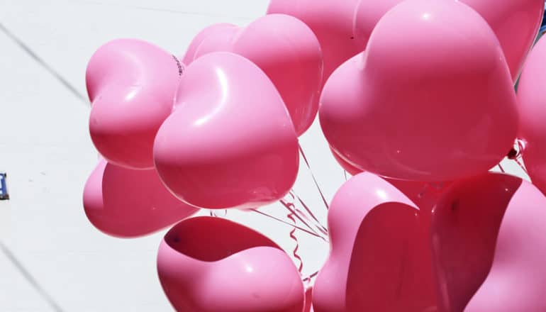 Several pink heart-shaped balloons