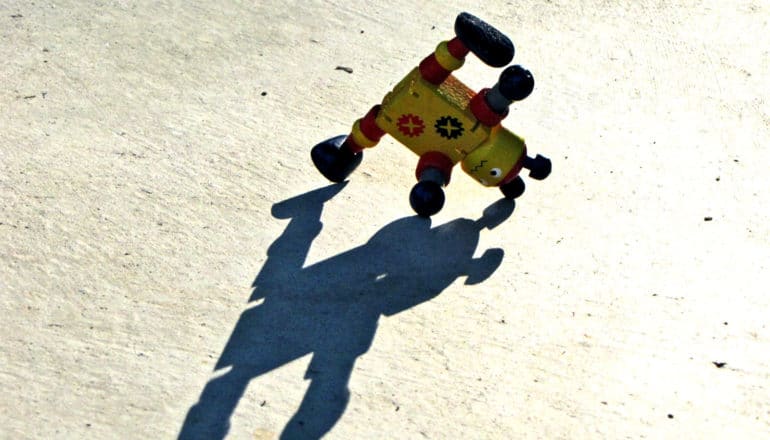 A toy robot looks like it's doing a cartwheel