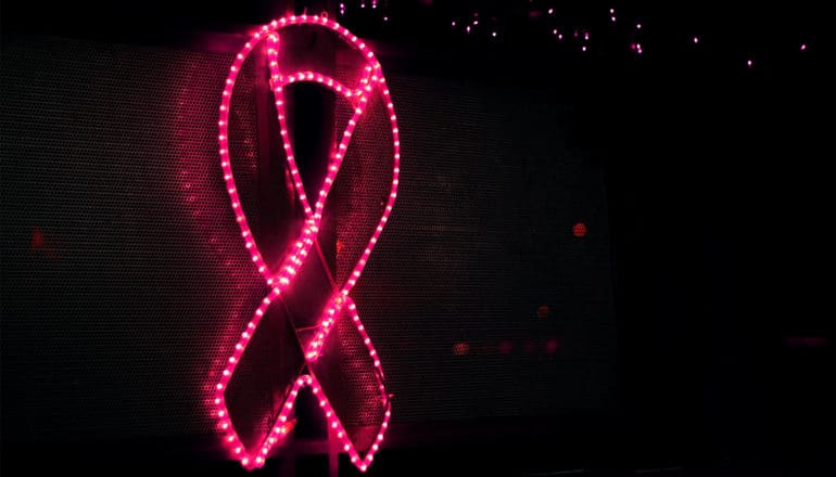 Pink lights form the shape of a pink ribbon